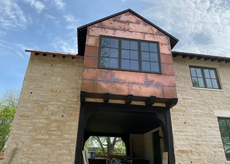 Copper metal panel facade on a stone building for Metal Roof Coating in Conover